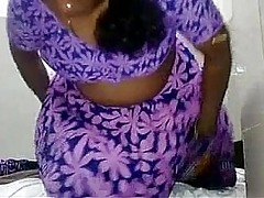 Indian skirt encircling purple dress plowed